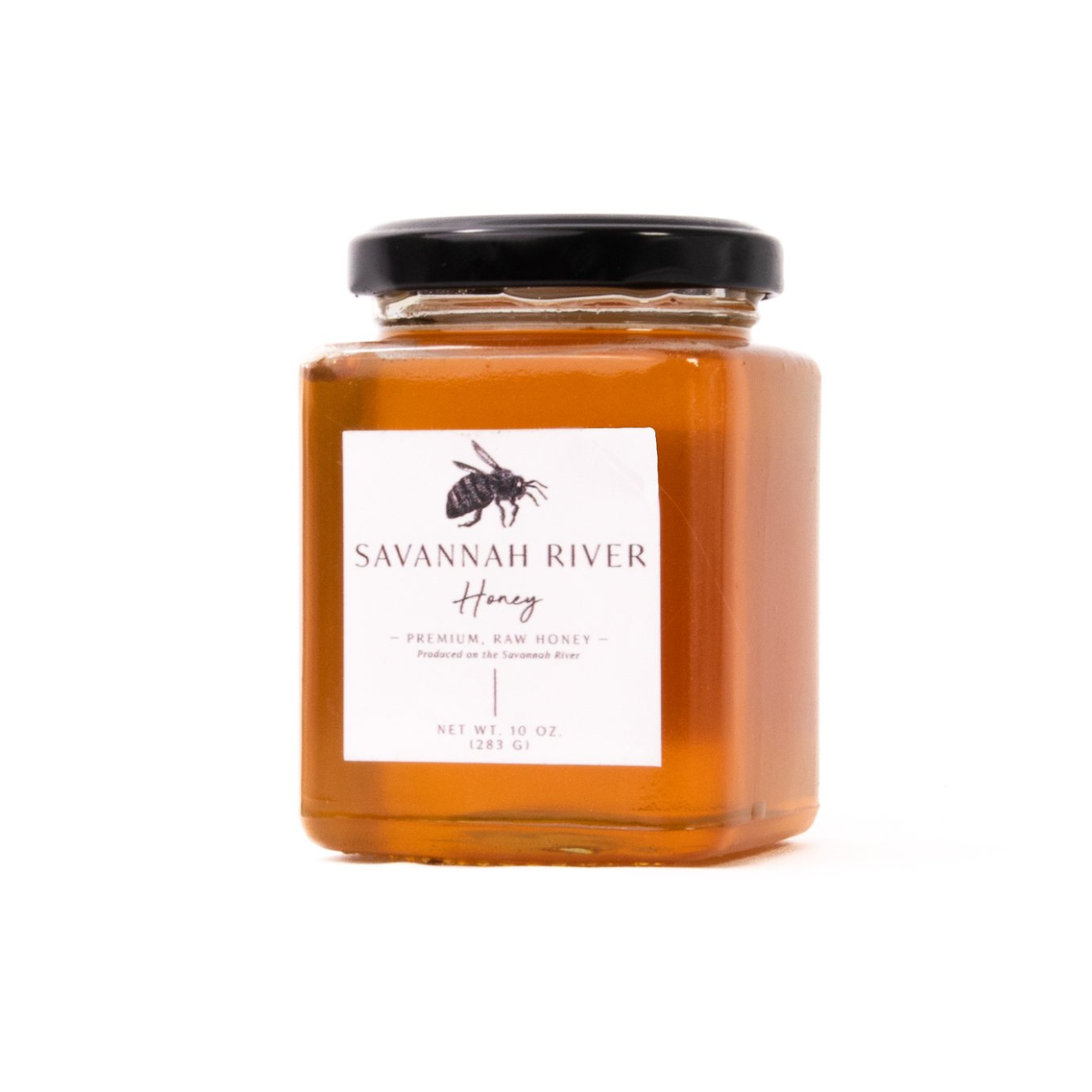 Pure unfiltered raw honey golden color in glass container